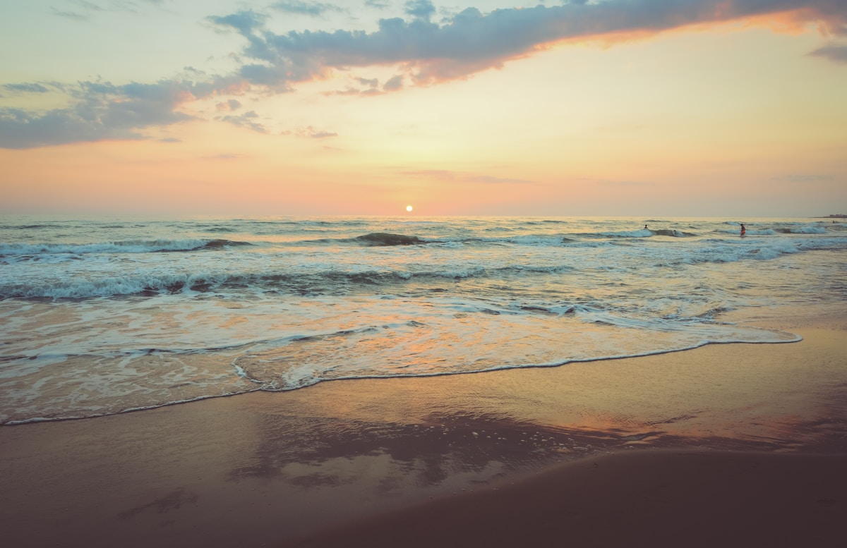 scenic beach shoreline at golden hour