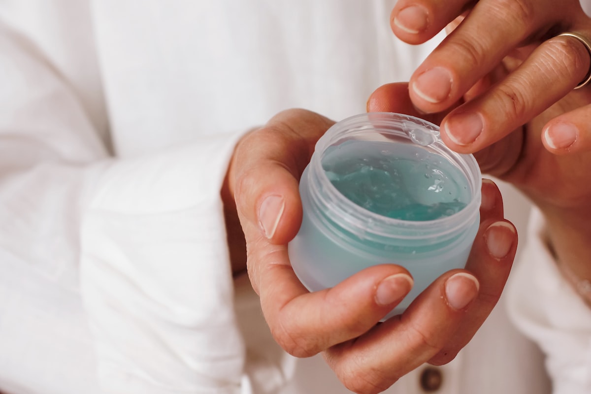 Woman applying skincare serum as part of morning routine